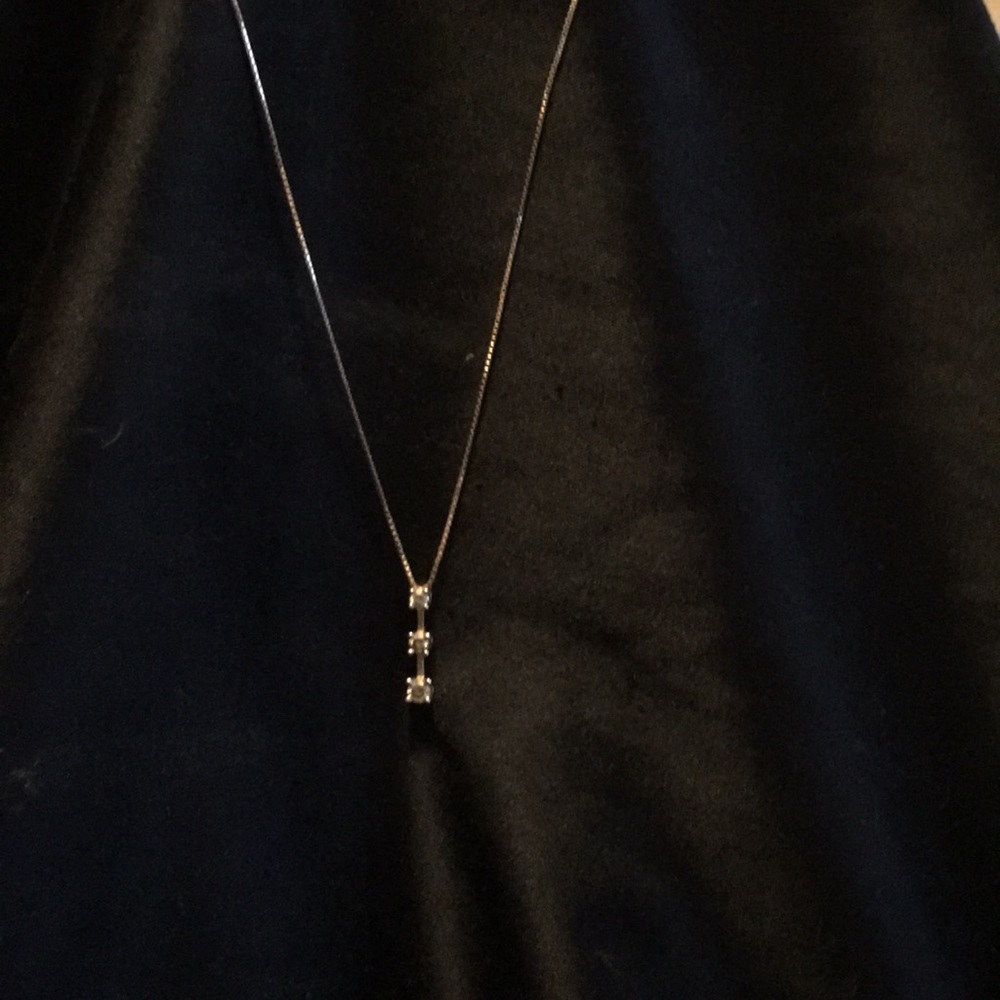 Three stone diamond pendant with chain both 14k
